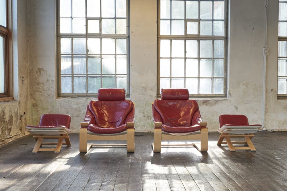 A pair of Swedish Kroken Leather Lounge Chairs and Stools