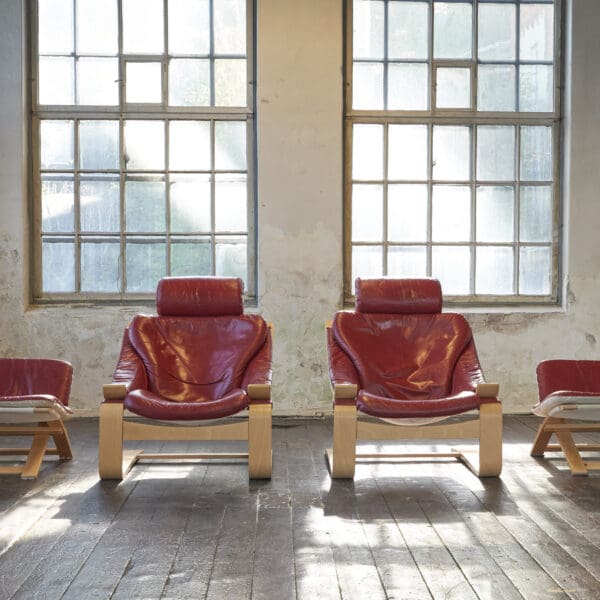 A pair of Swedish Kroken Leather Lounge Chairs and Stools